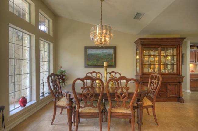 Soaring high ceilings in executive style luxury custom home living room