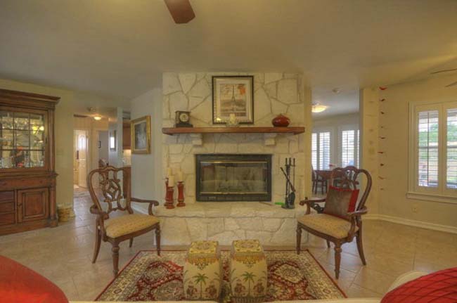 Elegant stone fireplace focal point in luxury custom home living room
