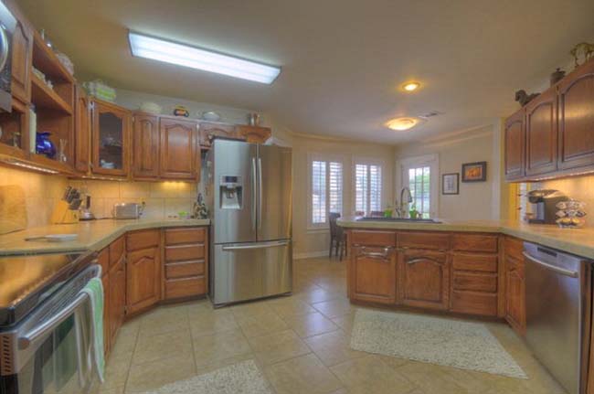 Stylish gourmet kitchen with premium finishes in luxury custom home Kerrville TX
