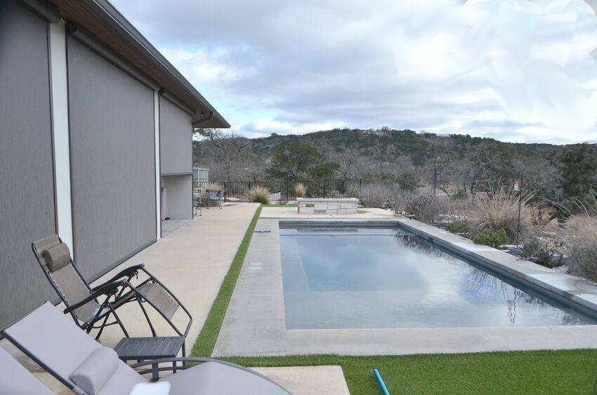 Pool with screened patio and panoramic Hill Country views - Riverside Home Designs Custom Home Portfolio