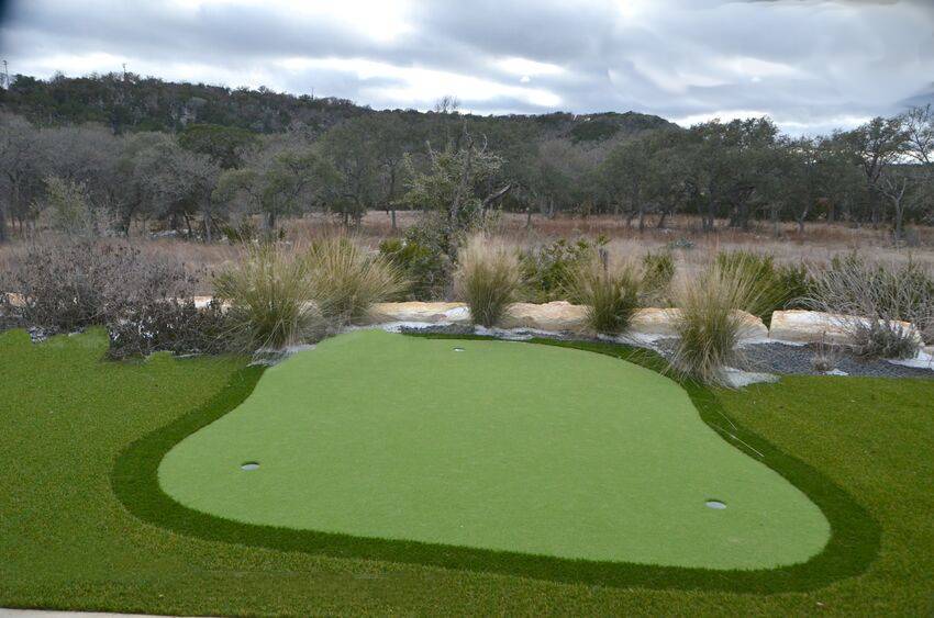 Private putting green with native landscaping in Texas Hill Country - Riverside Home Designs Custom Home Portfolio