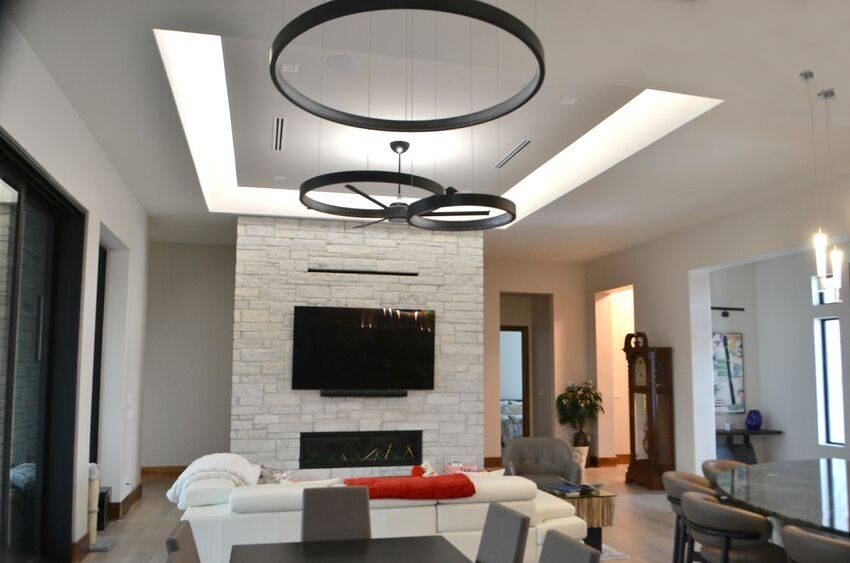 Great room with stone fireplace and linear gas insert in modern contemporary home - Riverside Home Designs Custom Home Portfolio